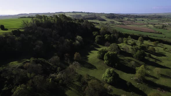 Beautiful Meon Hill Cotswolds Cinematic Aerial Landscape Sheep In Field Spring Season