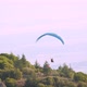 Aerial Shot of a Paraglider Taking off a Hill - VideoHive Item for Sale