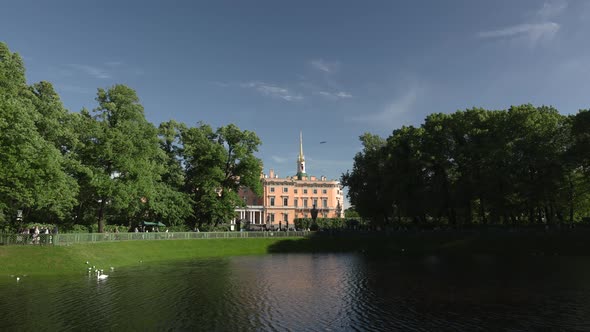 ancient historical building with a view of the park and the lake, Mikhailovsky Castle