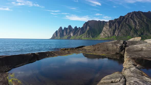 Beautiful Norwegian rocky coast and mountain ridge