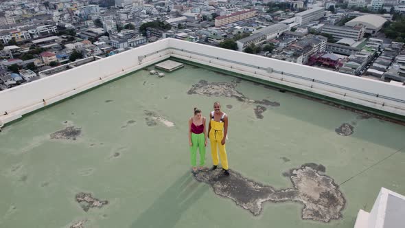 Drone Shot Of Fashion Models On City Rooftop alt
