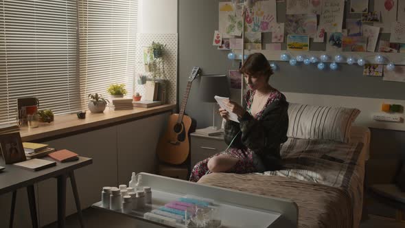 Girl Taking Notes in Hospital Room alt