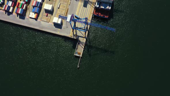 Container ship in export and import business and logistics. Shipping cargo to harbor by crane. Water alt