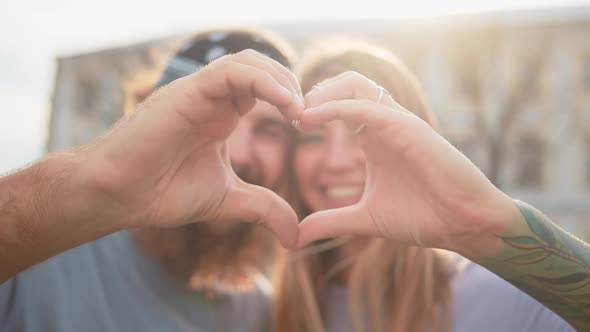 Beauty Close Up Portrait Happy Family Couple Making Heart Gesture with Fingers Hipster Man Tattoo alt