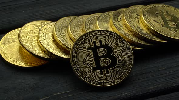 Gold Coins Bitcoin Cryptocurrency e-Commerce Lie on the Grey Table. Close Up alt