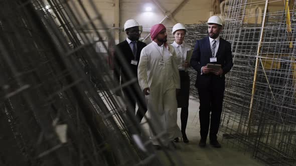 International visitors going through armature manufacture