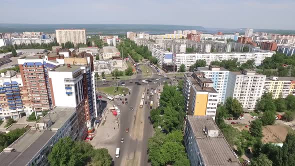 Camera Is Flying Over Calm City in Summer Sunny Day, Aerial Panorama