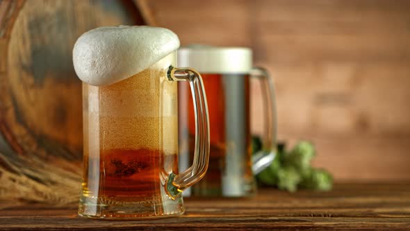 Super Slow Motion Shot of Overflowing Fresh Beer in Glass on Black Background at 1000Fps alt