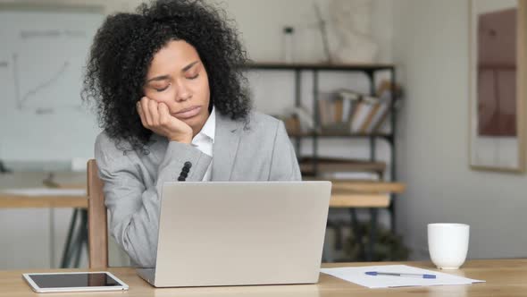 African Businesswoman Sleeping at Work alt