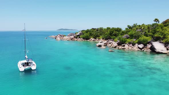 Stone beach and yacht in Seychelles