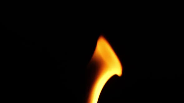 Beautiful fire flames isolated on black background in slow motion
