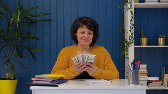 Middle Aged Woman Holding in Hands Money Cash Dollars alt