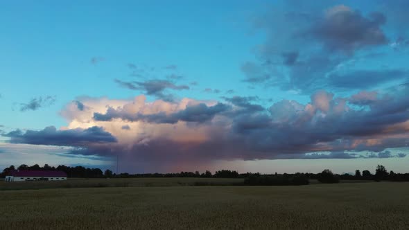 Crop Field After Rain and Storm Clouds in Background Rural Countryside, Aerial Dron Shot alt