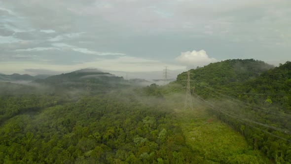 Aerial view Morning scenic on high mountains with electricity pylon.