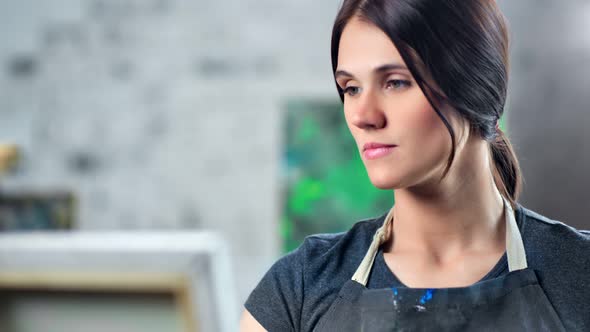 Tilt Up Female Painter Taking Color Paint From Palette Using Brush Enjoying Creating Picture alt