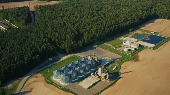 Aerial Elevated Top View Modern Granary Graindrying Complex Commercial Grain Or Seed Silos In Sunny alt