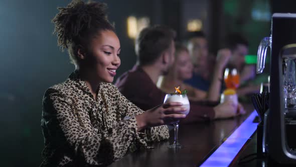 Alone Pretty Woman Sitting at Bar in Night Club alt