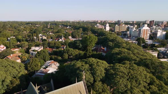 Cinematic aerial shot revealing San Isidro Cathedral and flying beside spire at golden hour alt