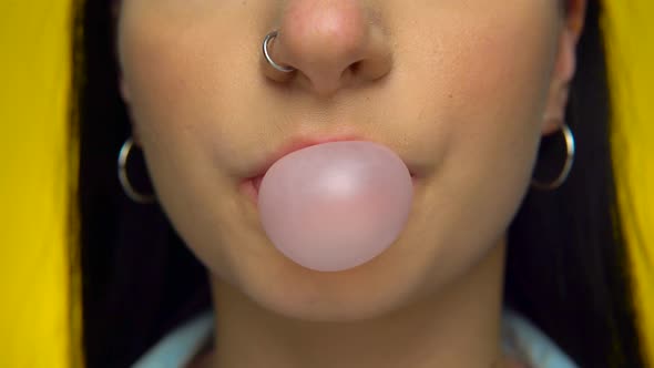 Young Smiling Happy Girl Blowing Bubble Gum Candy Chawing Mouth