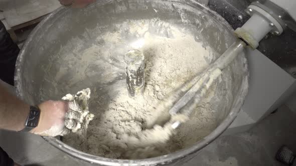 Industrial mixer for kneading dough. Mixing equipment in bakery. alt