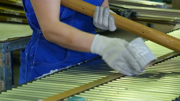 Conveyor with a Worker on the Production of Metal Parts