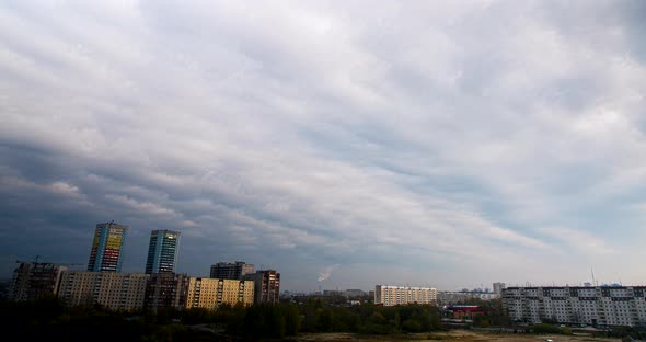 City Buildings Under Cloudy Sky alt