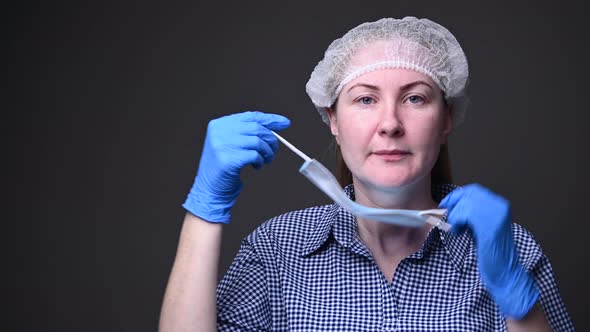 The Girl Takes Off Her Medical Mask. The Epidemic Is Over. Covid-19 Virus and Pneumonia in China alt