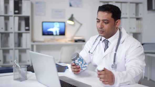 Doctor Showing Bottles With Pills alt