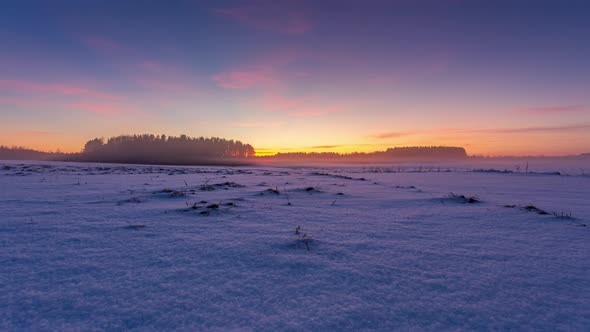 Fog moving over the snow at cold winter evening, arctic frost, 4k timelapse video alt