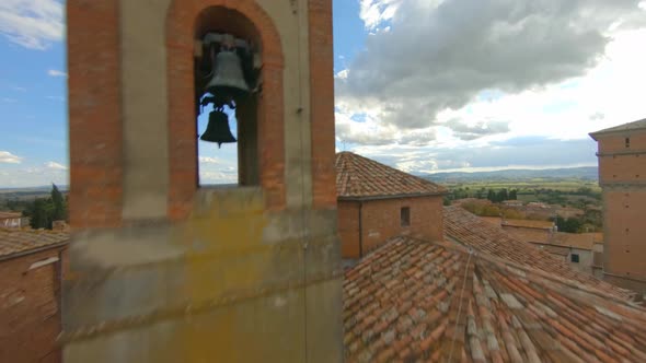 Church of San Cristoforo, Bettolle, Tuscany. Fpv drone view of the Italian village of Bettolle alt