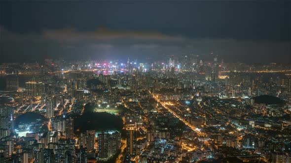 Hong Kong, China - Wide angle view of the city and its bay from day to night