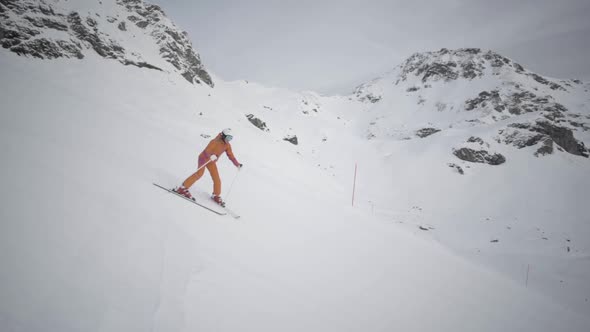 Slow Motion Woman Skiing in Downhill Position