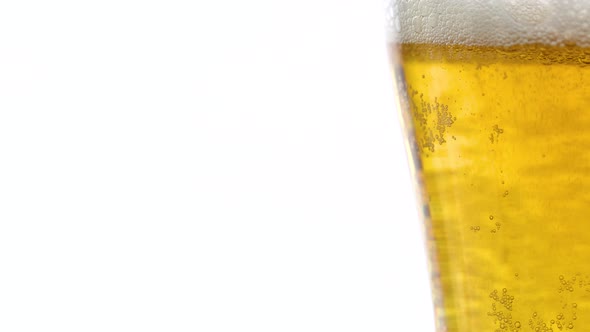 Glass With Beer And Foam On A White Background