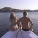 Couple Sitting On The Edge Of A Boat - VideoHive Item for Sale