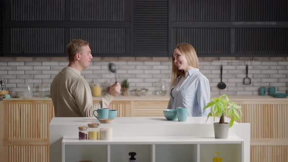A Young Couple Man and Woman in the Morning Dance Together to the Music alt