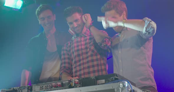 Friends having fun while listening music in nightclub