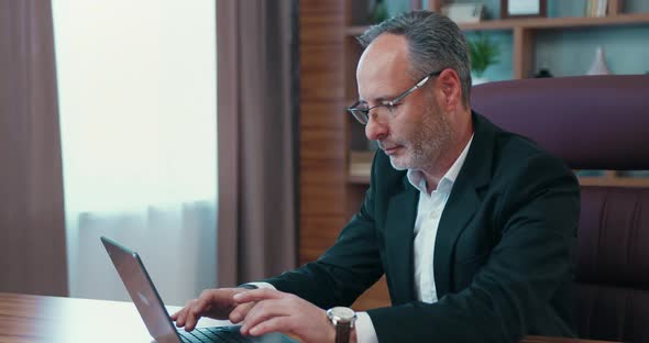 Middle Age Male Ceo Executive Manager in Suit Working at Laptop alt