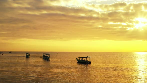 Silhouettes of Three Tourist Fishing Boats in the Arabian Sea, Indian Ocean, Goa, India alt