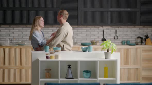 A Young Couple Man and Woman in the Morning Dance Together to the Music alt