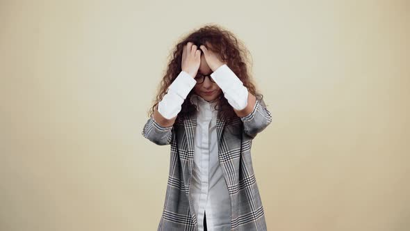 Exhausted Young Woman Tired with Her Hands in Her Hair Breathing Hard alt