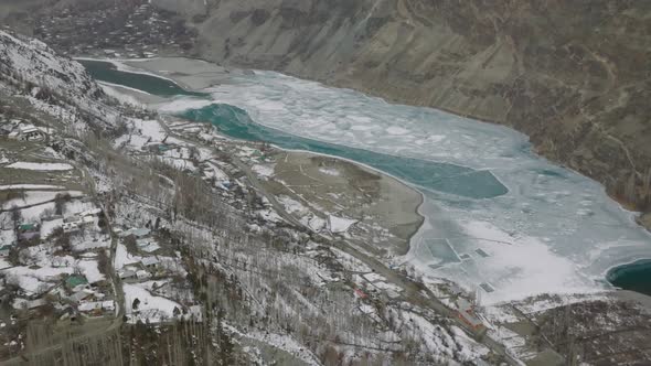 Cinematic Aerial View Of Frozen Khalti Lake In Gupis-Yasin Valley. Aerial Flying Over Frozen khalti alt