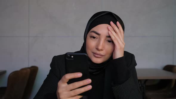 Shock Sad Muslim Woman in Hijab Receives Bad News on Her Phone