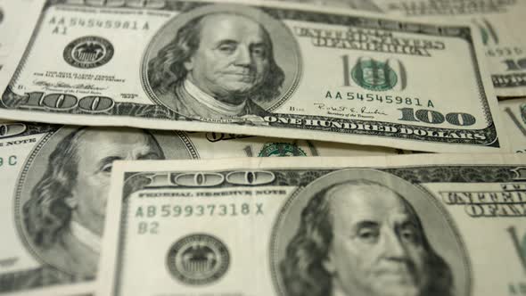 Hundred Dollar Bills Falling In a Pile alt