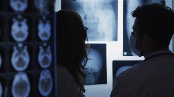 Nurse and doctor talking alt