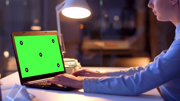 Businesswoman with Green Screen on Laptop at Night 70 alt
