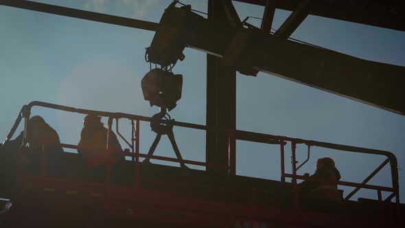 Builders Are Engaged in the Installation of Complex Metal Structures. The Construction of a Shop or alt