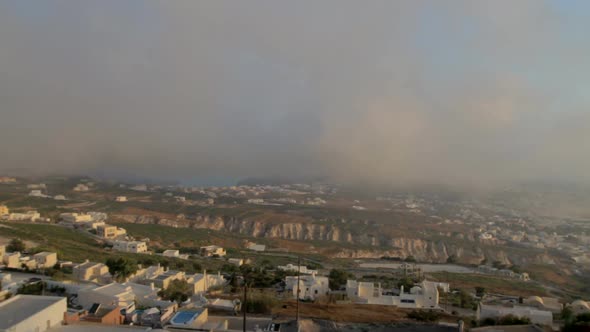 Time Lapse of a foggy morning scene on a cycladic island. Santorini, Greece. Traditional cycladic ar alt