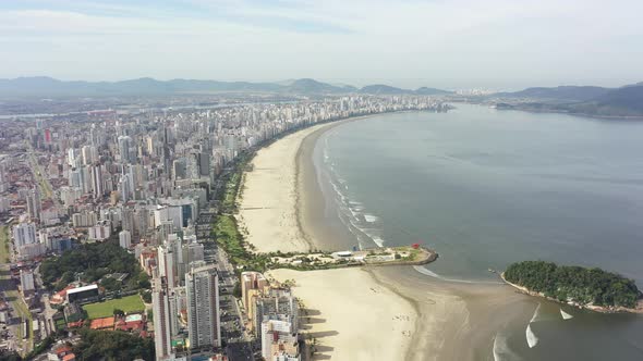 Panning wide landscape of coast city of Sao Vicente state of Sao Paulo Brazil. alt