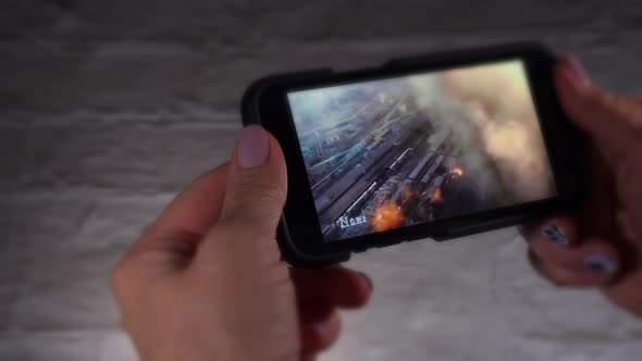 Closeup Shot of Someone Looking at News From Social Media on a Smartphone alt