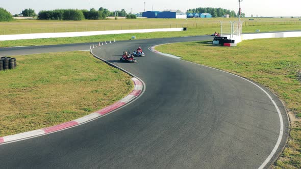 Circuit with Gocarts Racing Through It alt